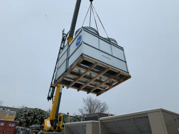 A BAC cooling tower being lifted by a crane
