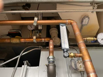 HVAC unit with soldered copper pipe, temperature and pressure gauges
