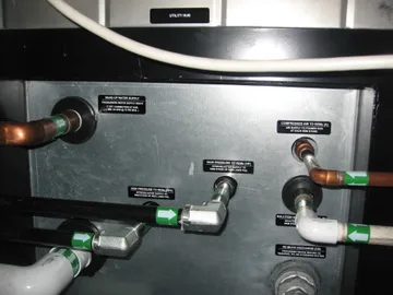 Copper, steel, and PVC pipes connect to a utility hub